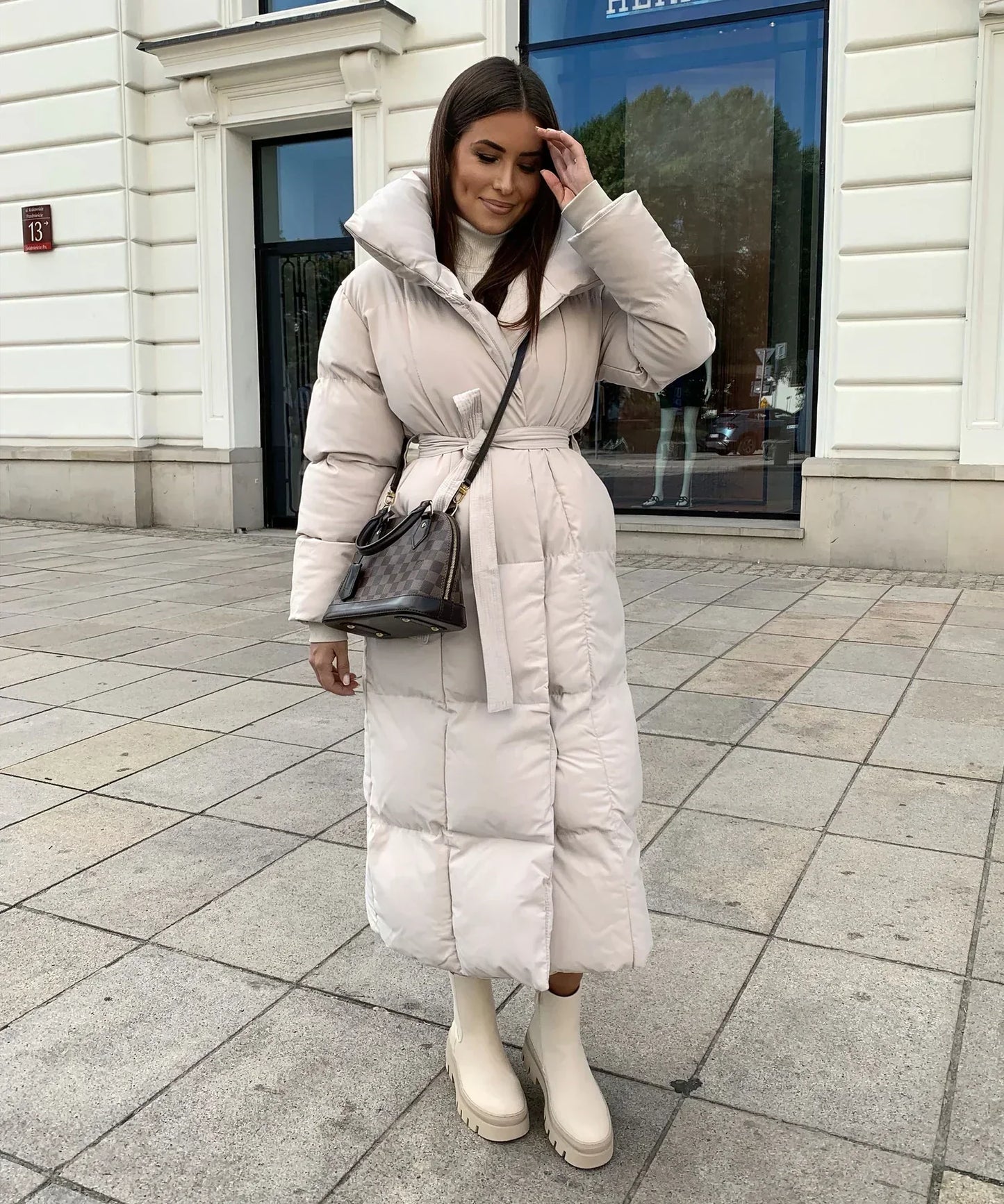 Wifey | Lange gesteppte Pufferjacke mit Gürtel